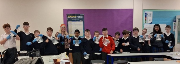 students showcasing their experiment results